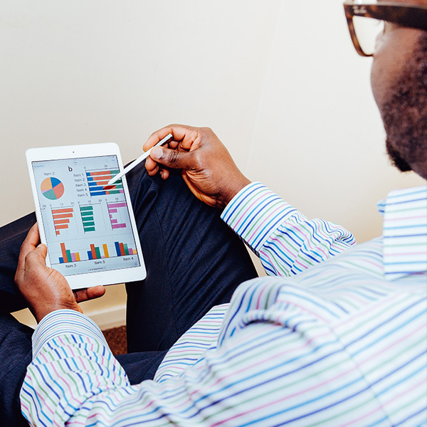 looking at analytics data on tablet looking at analytics data on tablet