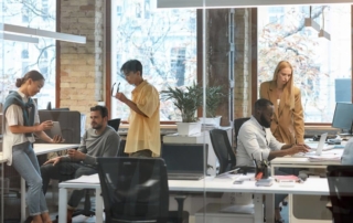 Businesspeople working in an office in the new technology hub after relocating to Texas from Silicon Valley.