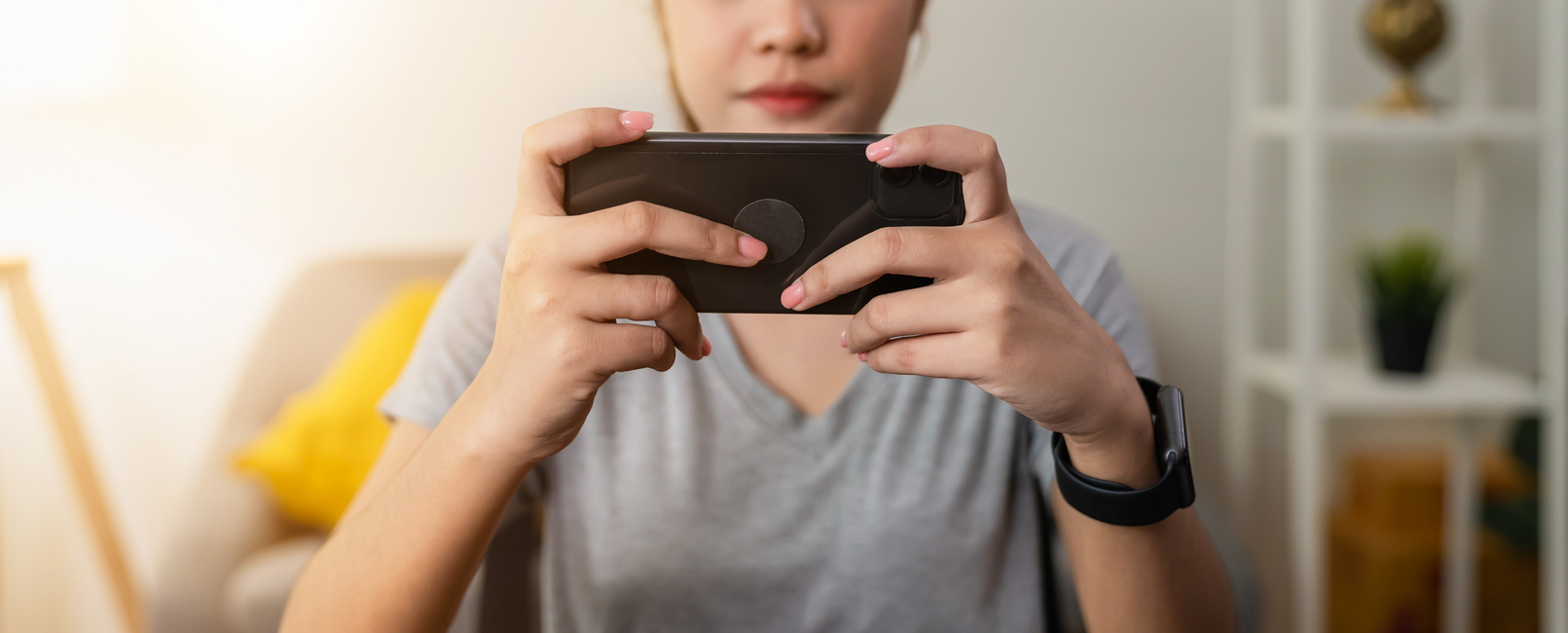 A woman is playing Wordle on her smartphone.